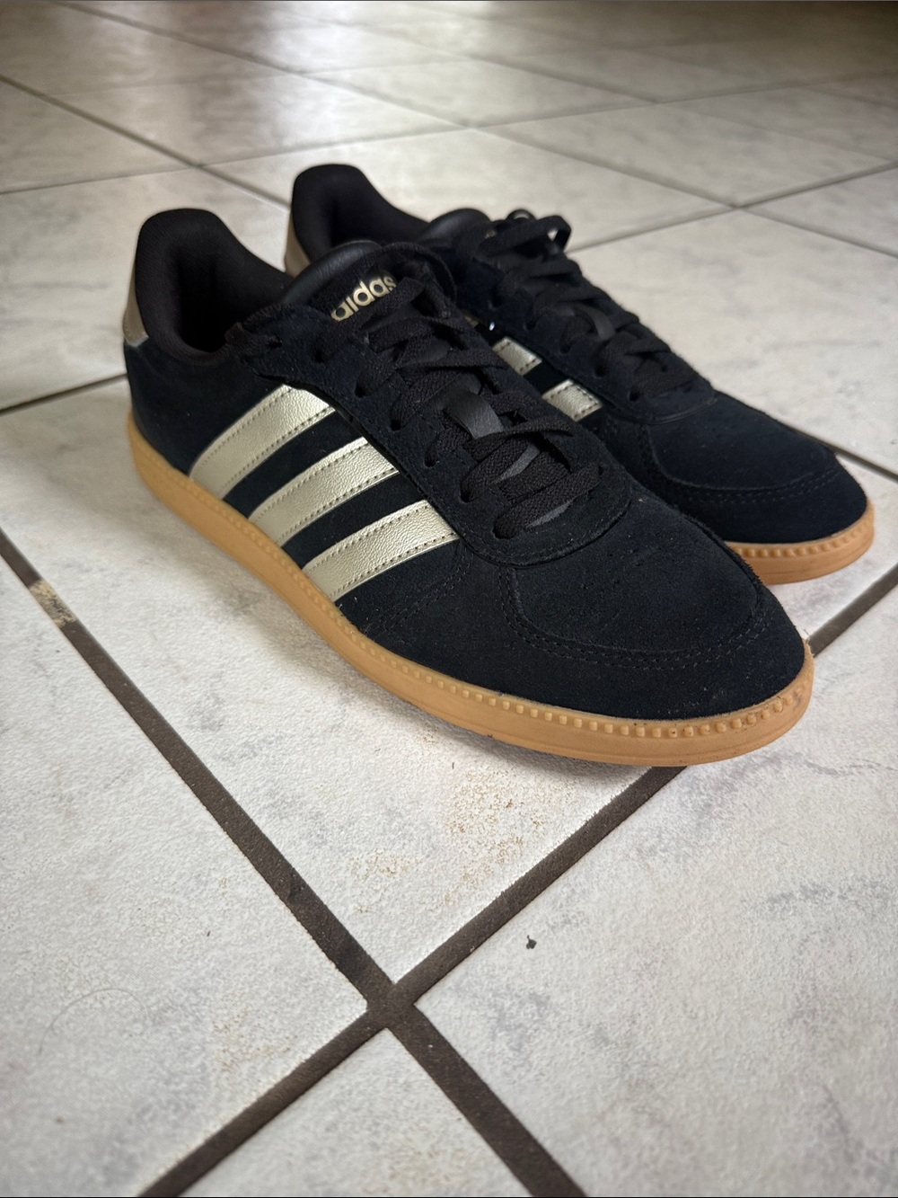 adidas Black Suede Sneakers with Gold Stripes and Gum Sole